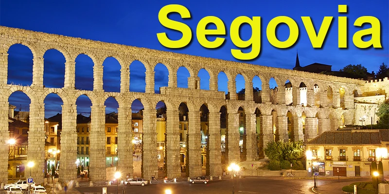 The Roman Aqueduct of Segovia towering over the plaza, its double tier of granite arches stretching into the distance